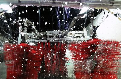 Close-up of wet red car