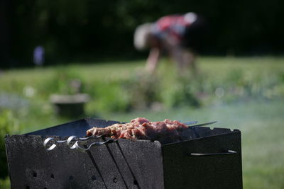 Close-up of meat on barbecue