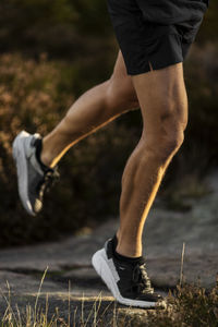 Low section of man jogging