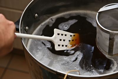 High angle view of person preparing food in kitchen at home