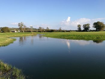 Scenic view of park against sky