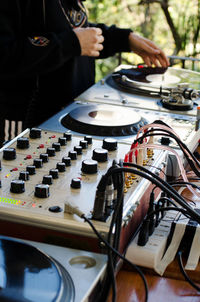 Midsection of dj with sound mixer