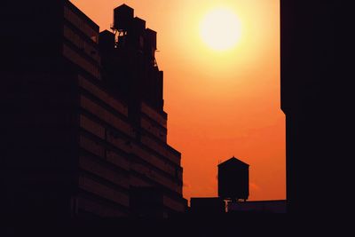Silhouette of building at sunset