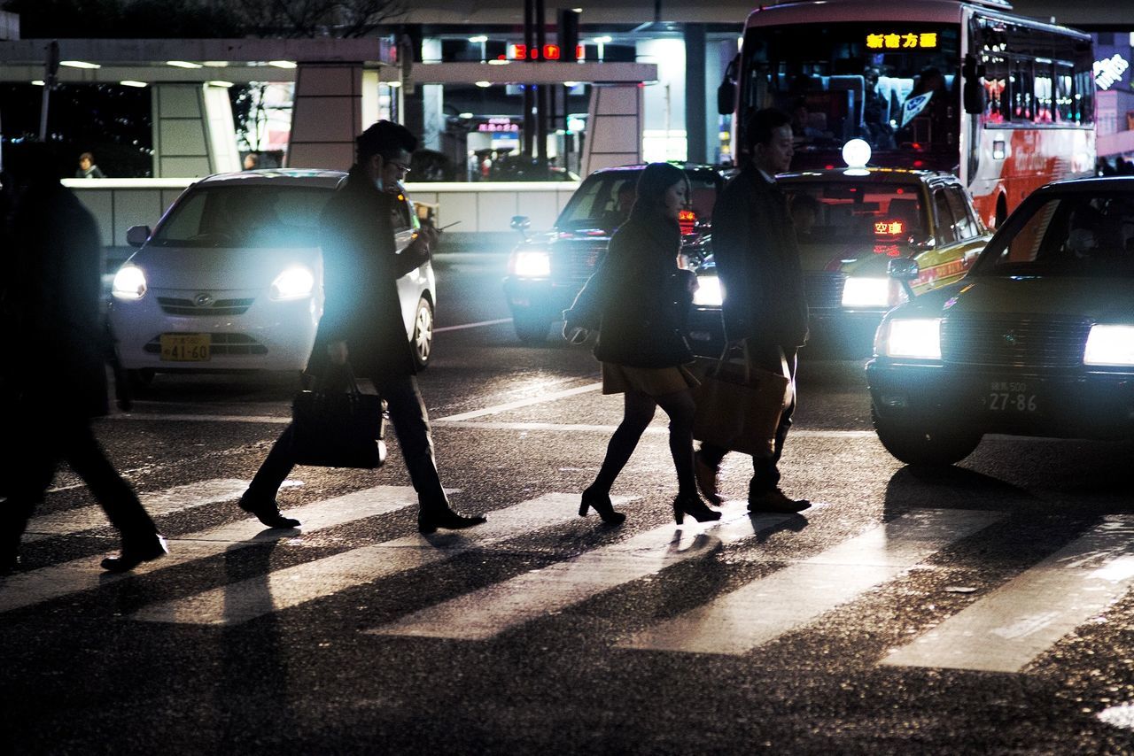 men, night, illuminated, full length, lifestyles, walking, person, indoors, city life, street, built structure, transfer print, architecture, leisure activity, auto post production filter, transportation, city, building exterior