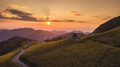 Scenic view of landscape against sky during sunset