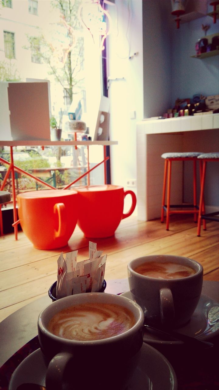 table, indoors, chair, food and drink, drink, restaurant, coffee cup, still life, absence, freshness, home interior, refreshment, plate, window, cafe, empty, dining table, saucer, sidewalk cafe, no people