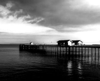 Pier over sea against sky