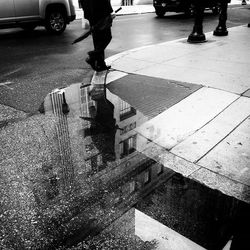 Low section of people walking on street