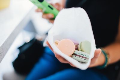 Close-up of hand holding ice cream