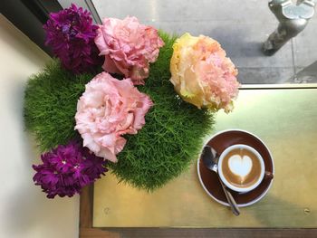 Close-up of pink roses on table