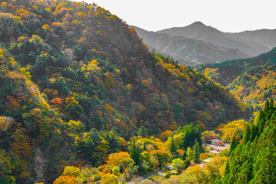 High angle view of trees and mountains against sky