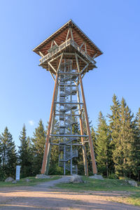 Low angle view of tower against clear blue sky