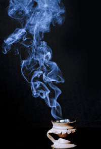 Close-up of smoke against black background