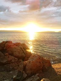 View of calm sea at sunset