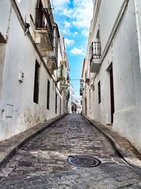 Narrow alley along buildings