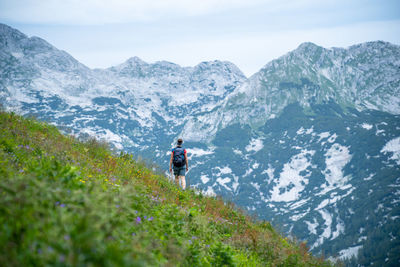 Woman hiking on alpine footpath in the austrian alps, loser mountain region, austria