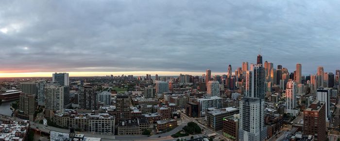 High angle view of cityscape against cloudy sky