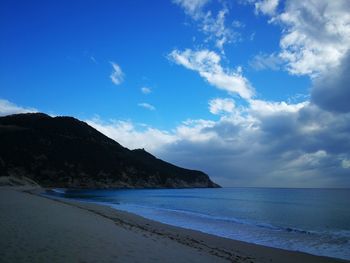 Scenic view of sea against blue sky