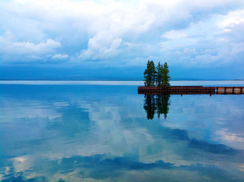 Scenic view of swimming pool by sea against sky