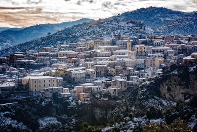 Townscape against mountain in winter