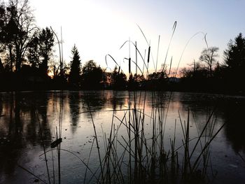 Scenic view of lake against sky during sunset