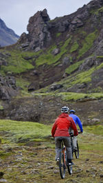 Two friends riding their mountain bikes around lake thingvellir