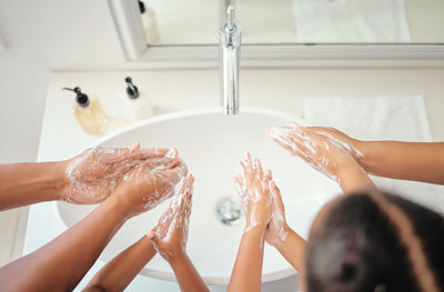 Cropped hand washing hands