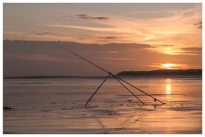 Scenic view of sea at sunset