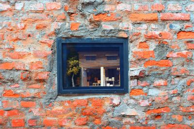 Window on brick wall of house