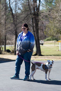 Full length of man with dog