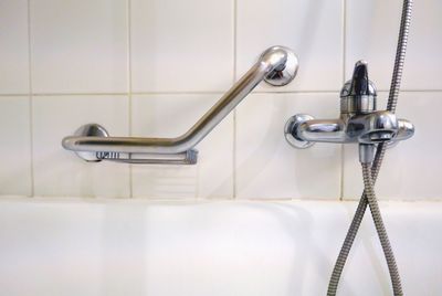 Close-up of faucet and bathtub in modern bathroom