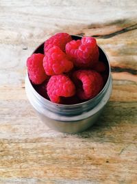 High angle view of strawberries in bowl on table