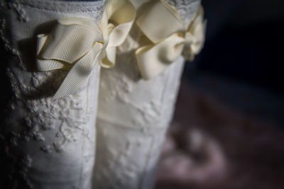 Close-up of white fabric with tied bows