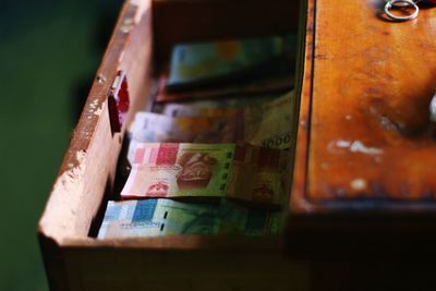 Close-up of paper currencies in box