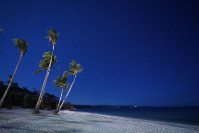 Scenic view of sea against sky at night