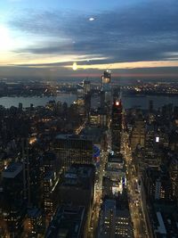 High angle view of illuminated city buildings at night