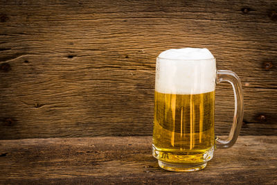 Close-up of beer glass on table