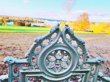 Close-up of metal wheel in park during autumn