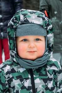 Portrait of cute boy in snow