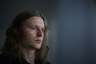 Portrait of crying woman looking away