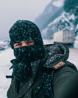 Portrait of person wearing hat during winter