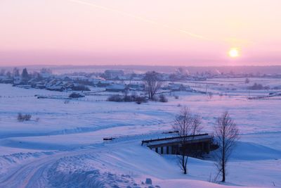 Scenic view of snow covered field