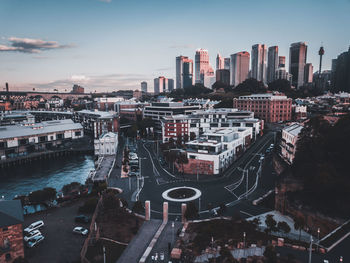 High angle view of city street and buildings against sky