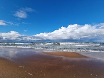 Scenic view of beach against sky