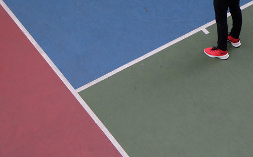 Low section of woman standing on ground