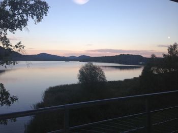 Scenic view of lake at sunset