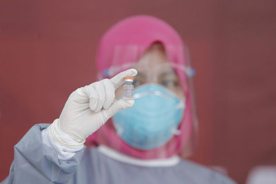 Close-up of human hand holding ring