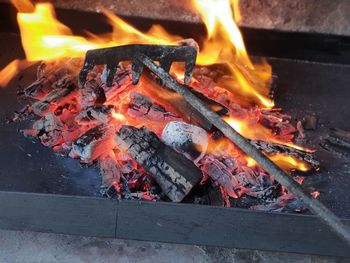 High angle view of fire on barbecue grill