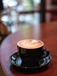 Close-up of cappuccino on table