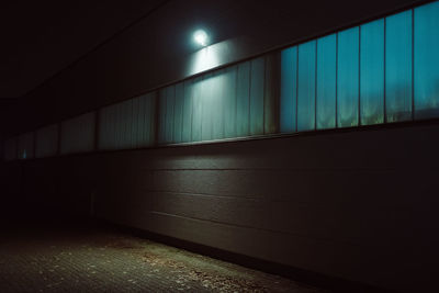 Illuminated walkway at night